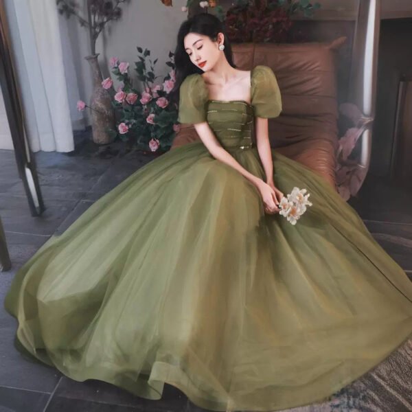 ⁦ملابس سهرة بتصميم جنية متقلبة باللون الأخضر⁩ - الصورة ⁦5⁩